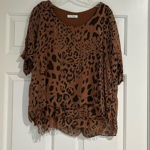 Animal print blouse with some frayed edge at the bottom